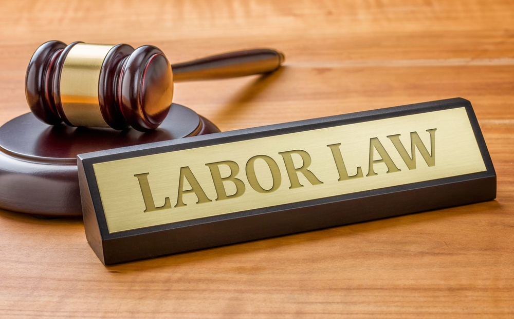 A gavel and a name plate with the engraving Labor Law
